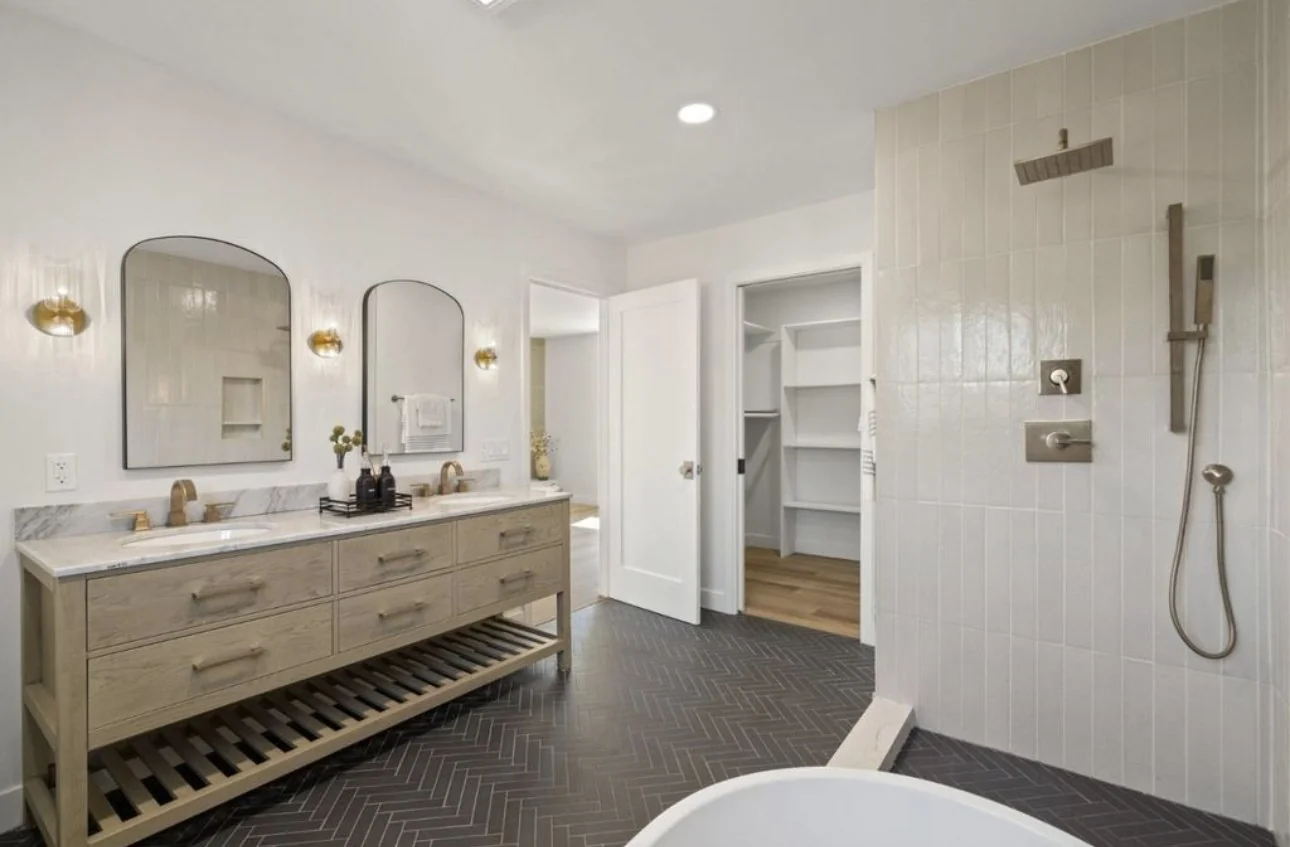 Bright bathroom with a double vanity and walk-in shower